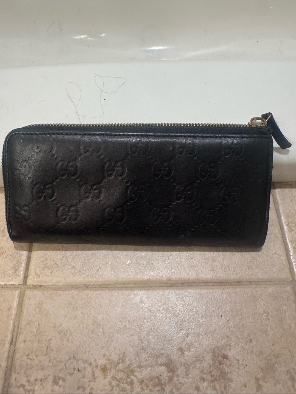 Gucci Guccissima Black Embossed GG Zip Wallet with Gold Hardware